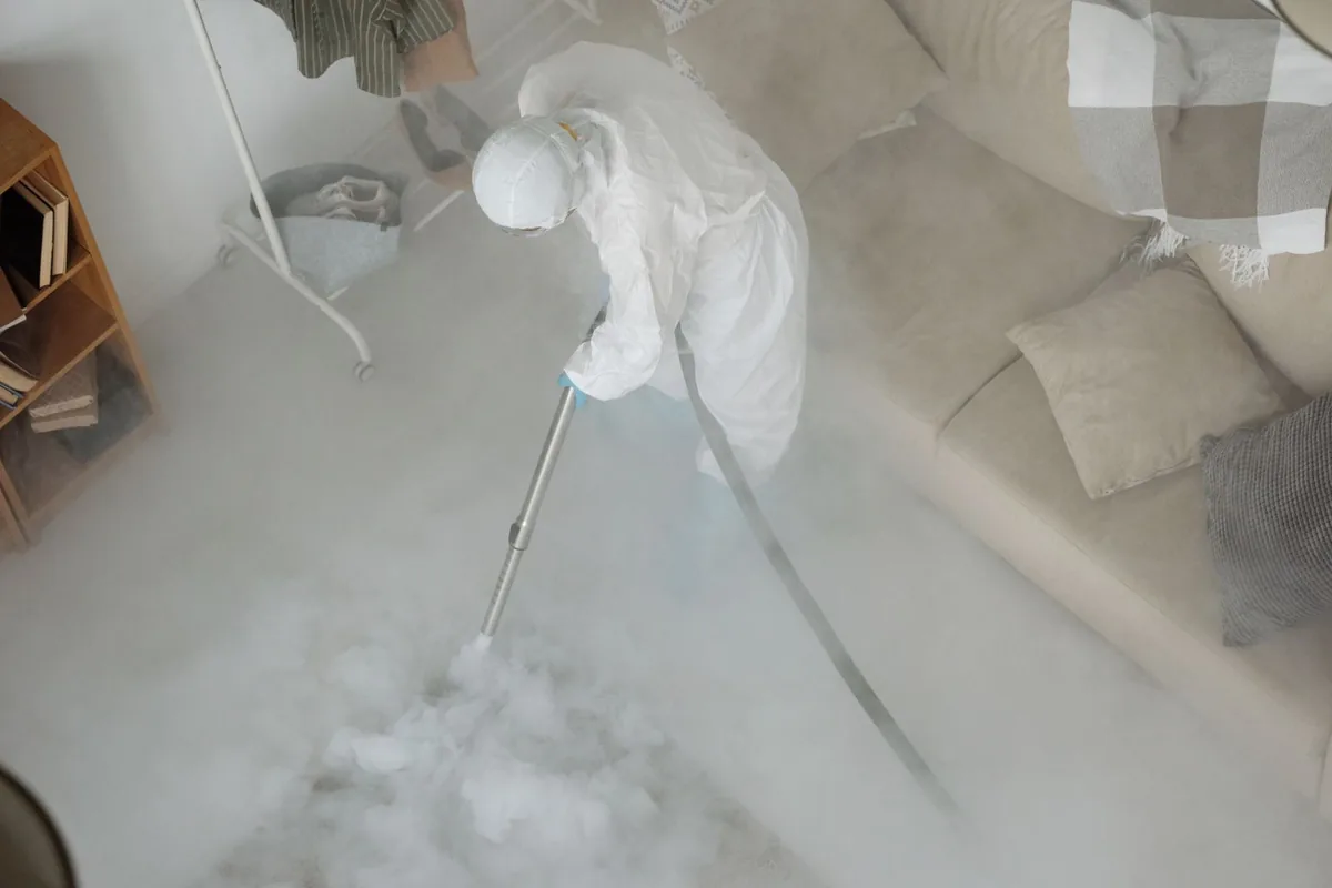 Biohazard cleanup technician in protective equipment, Lancaster, NY